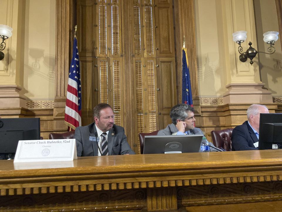 FILE -- Senate Finance Committee Chairman Chuck Hufstetler, R-Rome, left, and House Ways and Means Committee Chairman Shaw Blackmon, R-Kathleen, listen to a presenter during a meeting on Wednesday, June 14, 2023, at the Georgia Capitol in Atlanta. Hufstetler is pushing a measure in 2024 that would cap the increase in tax values of homes, while Blackmon is backing a different property tax relief plan. (AP Photo/Jeff Amy, File)