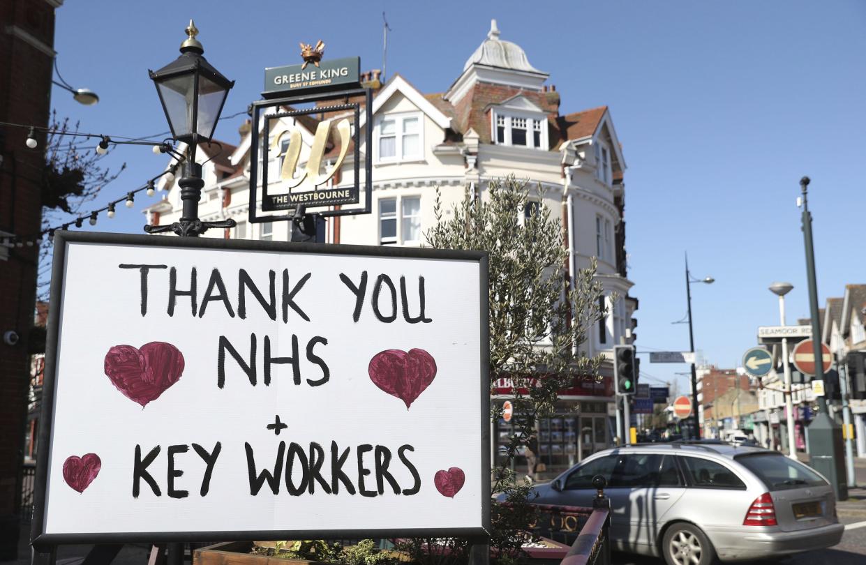 A sign thanking NHS staff and key workers is displayed outside The Westbourne pub in Bournemouth, south England as the UK continues in lockdown to help curb the spread of the coronavirus Wednesday April 1, 2020.