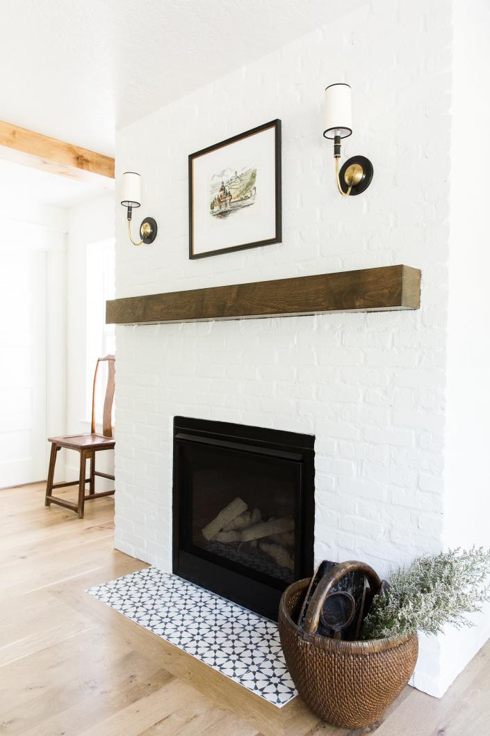 Fireplaces are often focal points in farmhouse design, and usually make use of brick or stone like this one by House of Jade.
