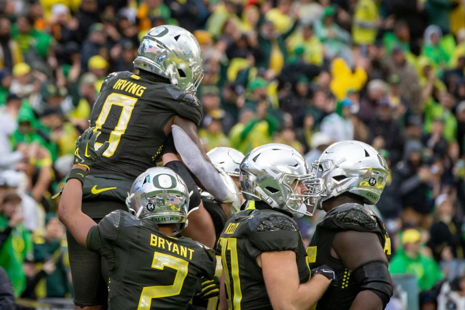 Oregon running back Bucky Irving is hoisted into the air to celebrate a touchdown as the No. 6 Oregon Ducks host California on Nov. 4 at Autzen Stadium in Eugene.