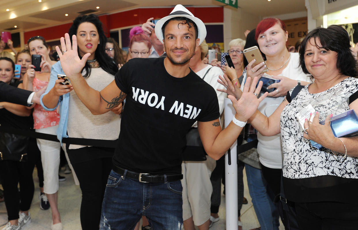 WOKING, ENGLAND - AUGUST 07:  Peter Andre meets fans and signs his new fragrance 'Breeze' on August 7, 2015 in Woking, England.  (Photo by Tabatha Fireman/Getty Images)