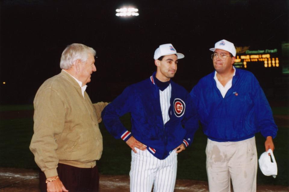 From left, Iowa Cubs owner Ken Grandquist, pitcher Jim Bullinger and general manager Sam Bernabe following the team's 1993 American Association championship.