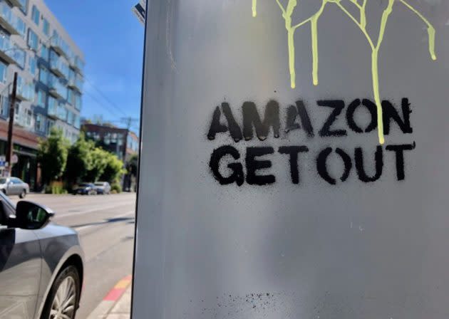 A stencil sprayed onto the side of a parking meter in Seattle’s Capitol Hill neighborhood has an unwelcome message for the city’s largest employer. (GeekWire Photo / Kurt Schlosser) <strong><a href="https://www.geekwire.com/2018/photos-graffiti-targeting-amazon-jeff-bezos-illustrates-animosity-toward-tech-giant-seattle/" rel="nofollow noopener" target="_blank" data-ylk="slk:Read the story.;elm:context_link;itc:0;sec:content-canvas" class="link ">Read the story.</a></strong>