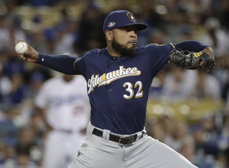 Milwaukee Brewers' Jeremy Jeffress throws during the ninth inning of Game 3 of the National League Championship Series baseball game against the Los Angeles Dodgers Monday, Oct. 15, 2018, in Los Angeles. (AP Photo/Jae Hong)