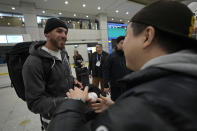San Diego Padres player Robert Suarez interacts with the crowd as he arrives at the Incheon International Airport In Incheon, South Korea, Friday, March 15, 2024. (AP Photo/Ahn Young-joon)