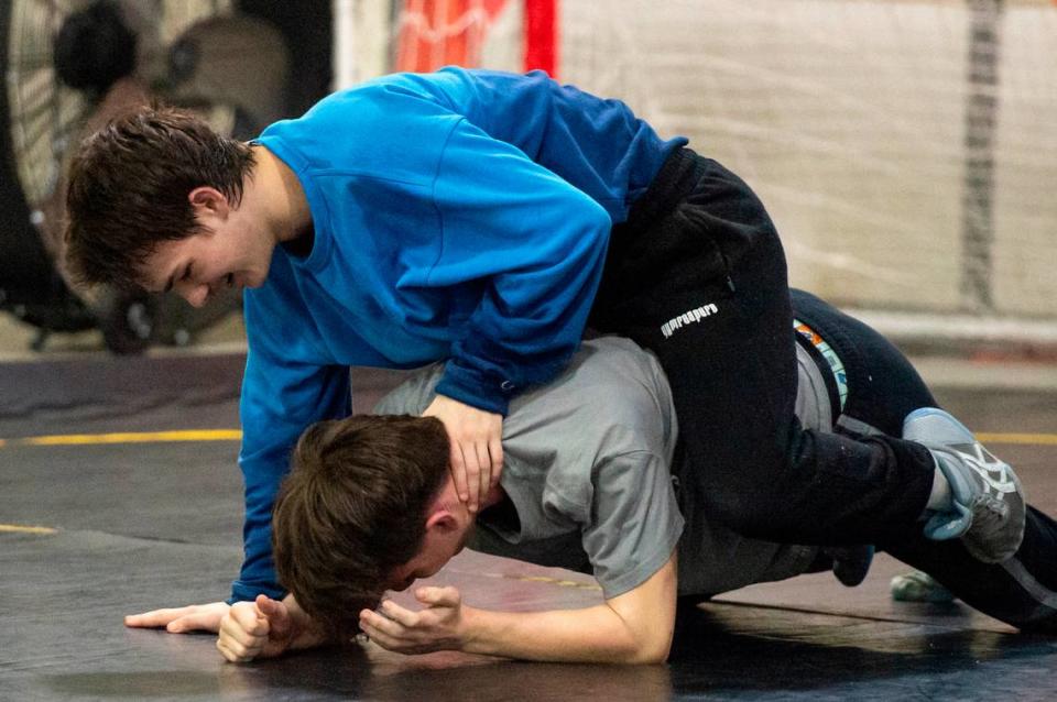 Gabe Shanks and Heisman Murphy practice wrestling moves on each other during Ocean Springs’ high school wrestling practice at E.H. Keys Alternative Education Center on Thursday, Feb. 8, 2024.