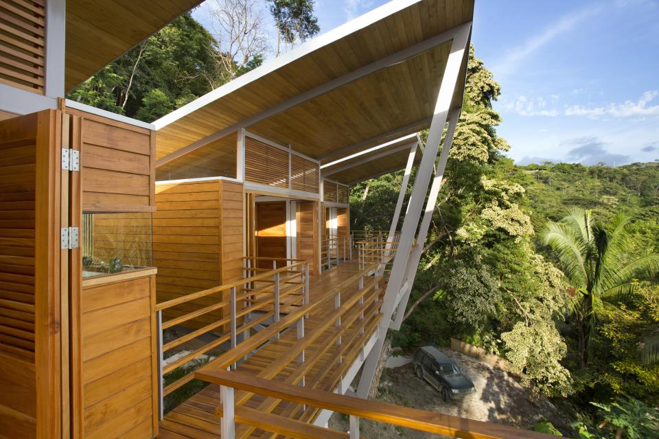 Architect Benjamin Garcia Saxe also designed Casa Flotanta in Puntarenas, Costa Rica. The three-bedroom house, which is on a steep slope, consists of three pods set on stilts that are connected by bridges and walkways.