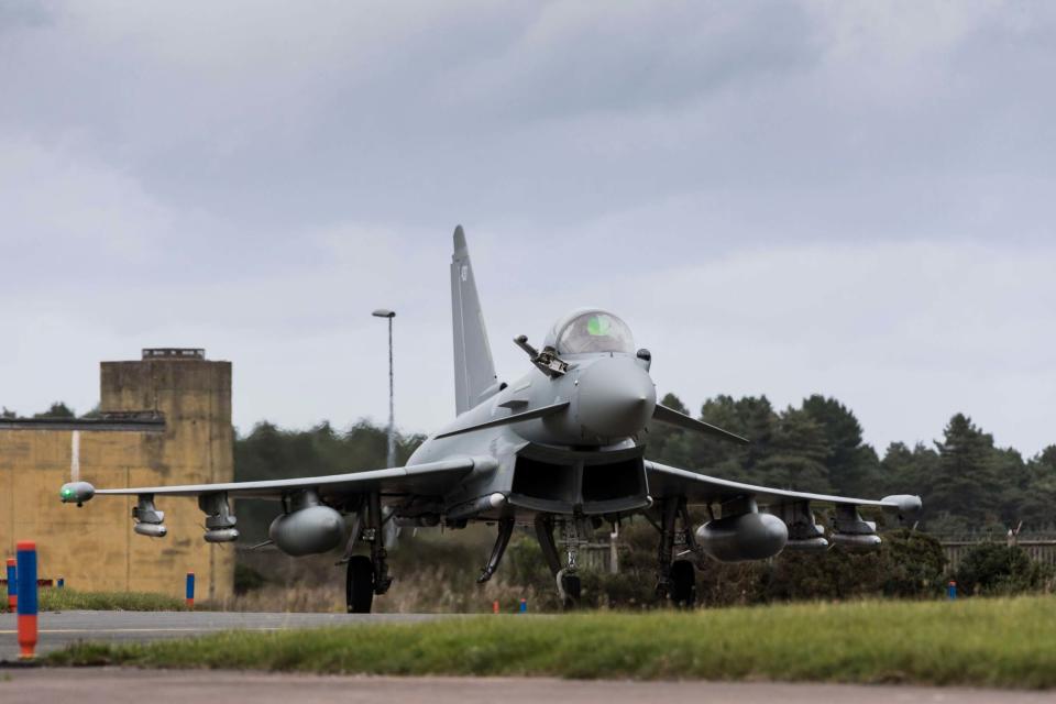 A Eurofighter Typhoon landing at Leuchars Station after returning from a Quick Reaction Alert to intercept two Russian aircraft off the Scottish Coast (PA)