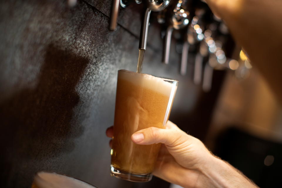 Beer is poured from a tap at Black Plague Brewery during the outbreak of the coronavirus disease (COVID-19) in Oceanside, California, U.S., October 15, 2020. REUTERS/Mike Blake