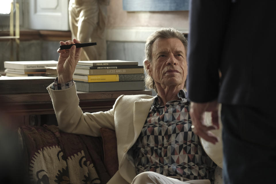 This image released by Sony Pictures Classics shows Mick Jagger in a scene from the film, "The Burnt Orange Heresy." This image released by Sony Pictures Classics shows Mick Jagger in a scene from the film, "The Burnt Orange Heresy." Jagger plays a devilish art collector who cunningly convinces an art journalist to use a rare interview with a reclusive artist as an opportunity to steal one of his paintings. It’s Jagger’s first film since 2001’s “The Man From Elysian Fields.” (Jose Haro/Sony Pictures Classics via AP)