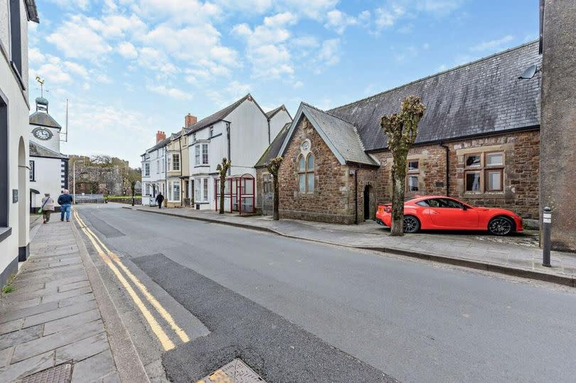 The schoolhouse is located in the heart of the town