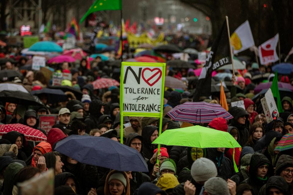 Demonstrators in Hamburg protest right-wing extremism and the AfD on Feb. 25, 2024. <a href="https://www.gettyimages.com/detail/news-photo/at-a-demonstration-against-right-wing-extremism-on-february-news-photo/2033875510?adppopup=true" rel="nofollow noopener" target="_blank" data-ylk="slk:Hami Roshan/Middle East Images/AFP via Getty Images;elm:context_link;itc:0;sec:content-canvas" class="link ">Hami Roshan/Middle East Images/AFP via Getty Images</a>