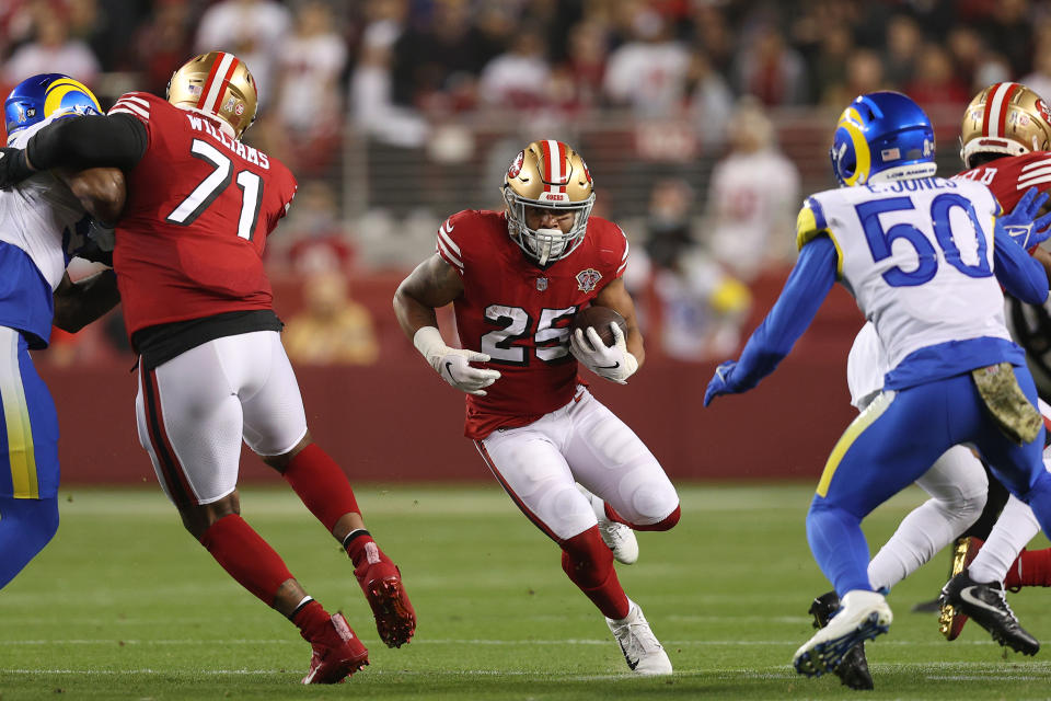 SANTA CLARA, CALIFORNIA - NOVEMBER 15: Eli Mitchell #25 of the San Francisco 49ers carries the ball during the first half against the Los Angeles Rams at Levi's Stadium on November 15, 2021 in Santa Clara, California. (Photo by Ezra Shaw/Getty Images)