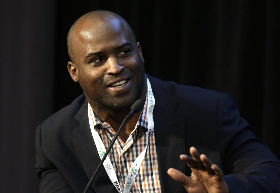 Former NFL RB Ricky Williams, who played for the New Orleans Saints and the Miami Dolphins among other teams, addresses an audience during a conference on medical marijuana at Harvard Medical School, Tuesday, April 11, 2017, in Boston. (AP)