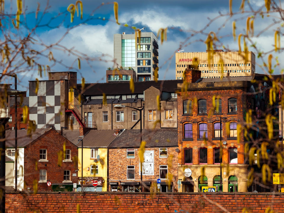 Manchester, England.  A view of the Northern Quarter that it is a trendy neighbourhood in Manchester. It is known due tolo the cool stres and restaurants as well as graffitis decorating some buildings.