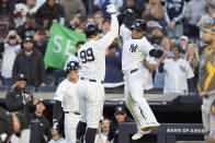 New York Yankees' Juan Soto, right, celebrates with Aaron Judge, left, after they scored on a two-run home run by Judge during the first inning of a baseball game against the Oakland Athletics, Wednesday, April 24, 2024, in New York. (AP Photo/Frank Franklin II)