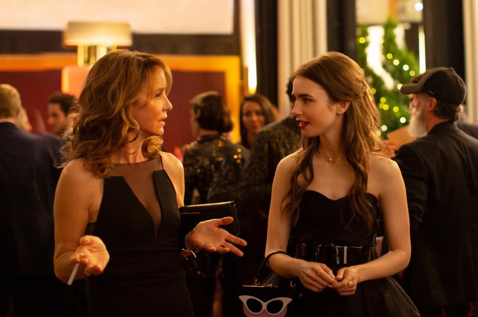 Philippine LeRoy-Beaulieu as Sylvie Grateau and Lily Collins as Emily Cooper in episode 102 of Emily in Paris