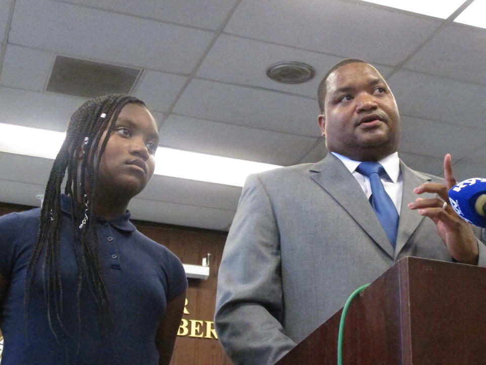 Marty Small speaks at a swearing-in ceremony in Atlantic City, N.J. on Friday Oct. 4, 2019 after becoming the gambling resort's acting mayor. His predecessor, Frank Gilliam Jr., resigned a day earlier after pleading guilty to stealing $87,000 from a youth basketball team. Listening was his daughter Jada, left. (AP Photo/Wayne Parry)