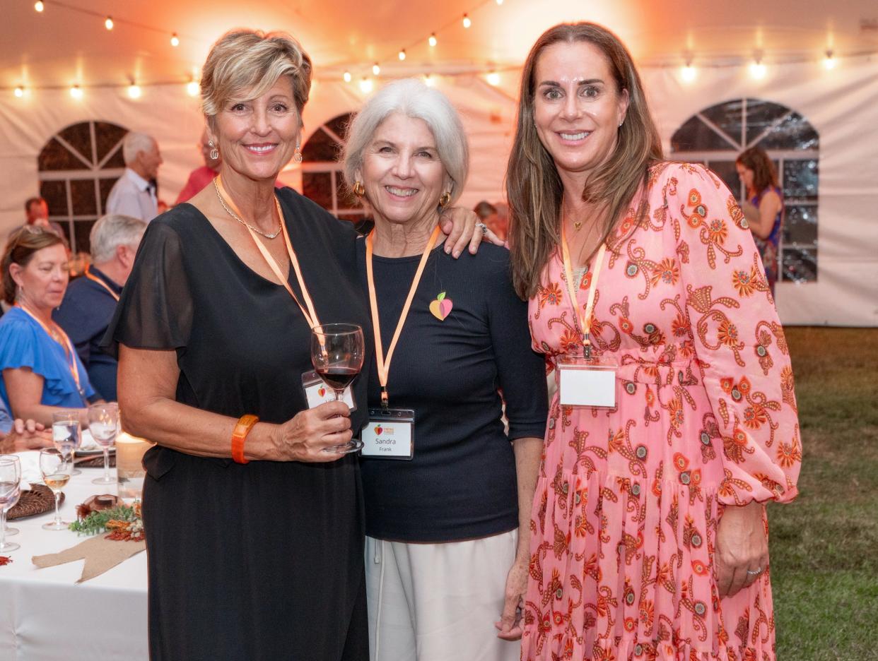 The inaugural “Friends FULL of Giving” fundraiser raised $276,000. From left, Friends FULL of Giving chair Lisa Napolitano, All Faiths Food Bank CEO Sandra Frank, and board chair Terri Vitale.