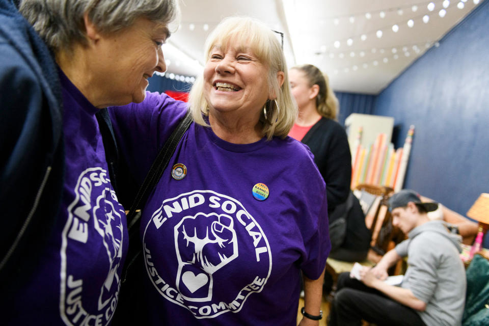 Connie Vickers, center, chats with a friend at the end of an Enid Social Justice Committee meeting on March 4. (Michael Noble Jr. for NBC News)