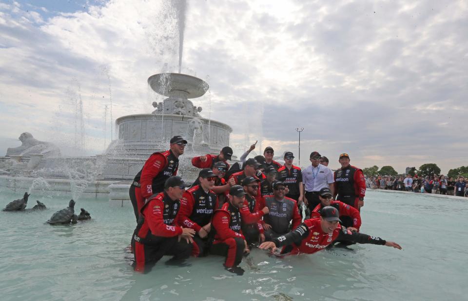 Will Power, driver of the Verizon Team Penske Chevrolet, celebrates with his team in the James Scott Memorial fountain after the IndyCar series Detroit Grand Prix on Sunday, June 5, 2022, on Belle Isle in Detroit.