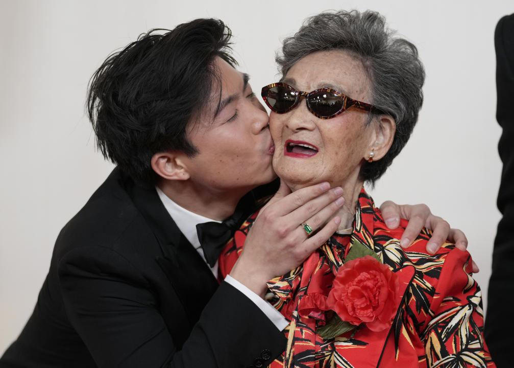 Sean Wang, left, and Chang Li Hua arrive at the Oscars on Sunday, March 10, 2024, at the Dolby Theatre in Los Angeles. (AP Photo/Ashley Landis)