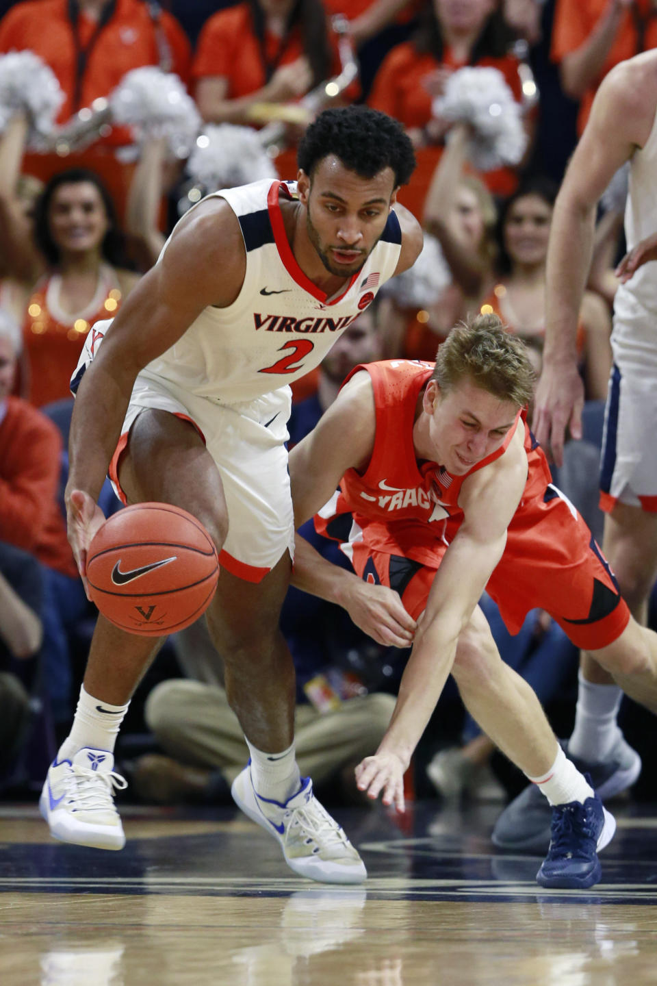 Virginia guard Braxton Key (2) steals the ball from Syracuse forward Marek Dolezaj (21) during the second half of an NCAA college basketball game in Charlottesville, Va., Saturday, Jan. 11, 2020. Syracuse defeated Virginia 63-55 in overtime. (AP Photo/Steve Helber)