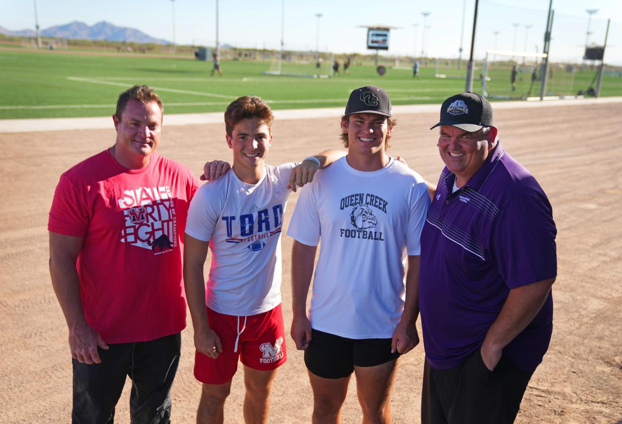 Jun 15, 2022; Mesa, AZ, USA;  Mountain View head coach Joe Germaine, left,  with his son, Jack, and Griffin Schureman with his dad, Queen Creek head coach Travis Schureman. Jack plays quarterback for his dad and Griffin plays offensive lineman for his dad.