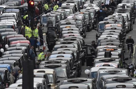 London cab drivers protest against Uber in central London, Britain February 10, 2016. REUTERS/Toby Melville