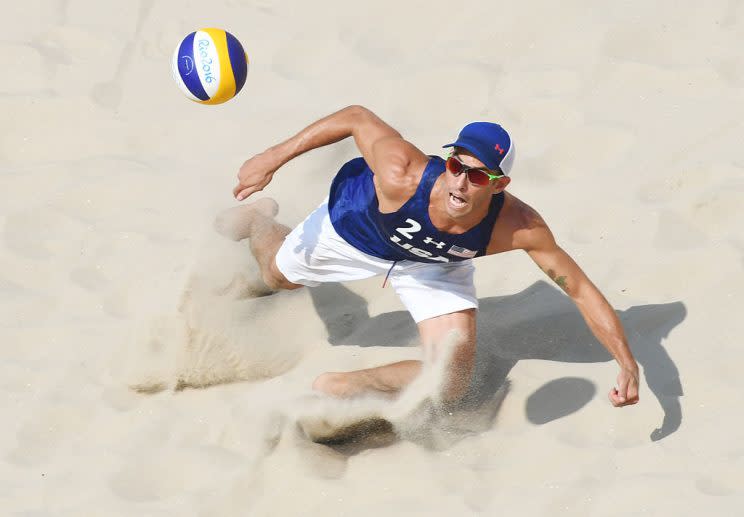 USA's Nicholas Lucena eyes the ball during the men's beach volleyball qualifying match between the USA and Mexico at the Beach Volley Arena in Rio de Janeiro on August 9, 2016, for the Rio 2016 Olympic Games. / AFP / Yasuyoshi Chiba (Photo credit should read YASUYOSHI CHIBA/AFP/Getty Images)