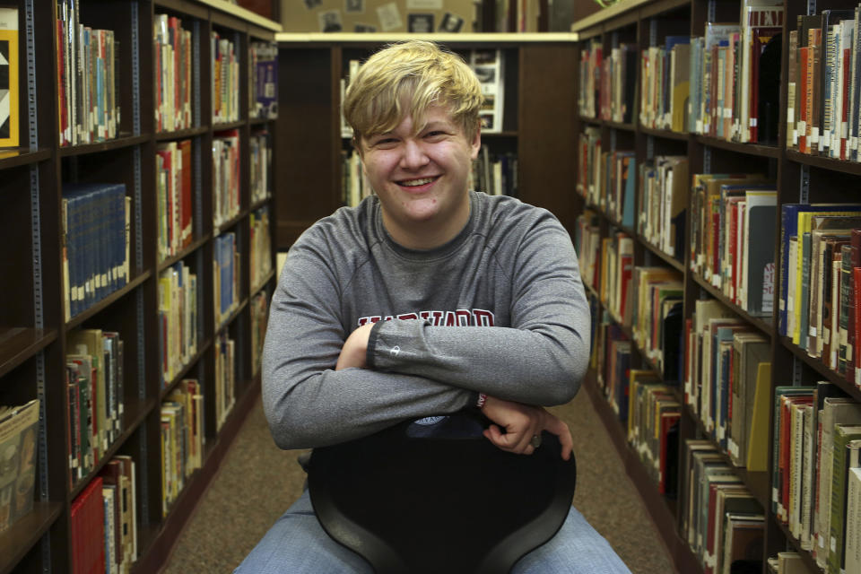 Ulysses High School senior Braxton Moral sits for a portrait at the school in Ulysses, Kan., on Wednesday, Dec. 12, 2018. The 16-year old will graduate from Harvard before he graduates from high school in May 2019. (Sandra J. Milburn/The Hutchinson News via AP)