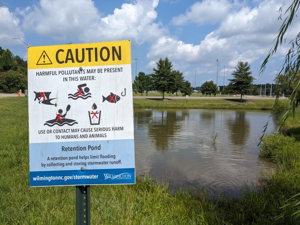 A sign at Olsen Park in Murrayville warns visitors about potentially dangerous algal blooms and toxins in one of the park's stormwater ponds.