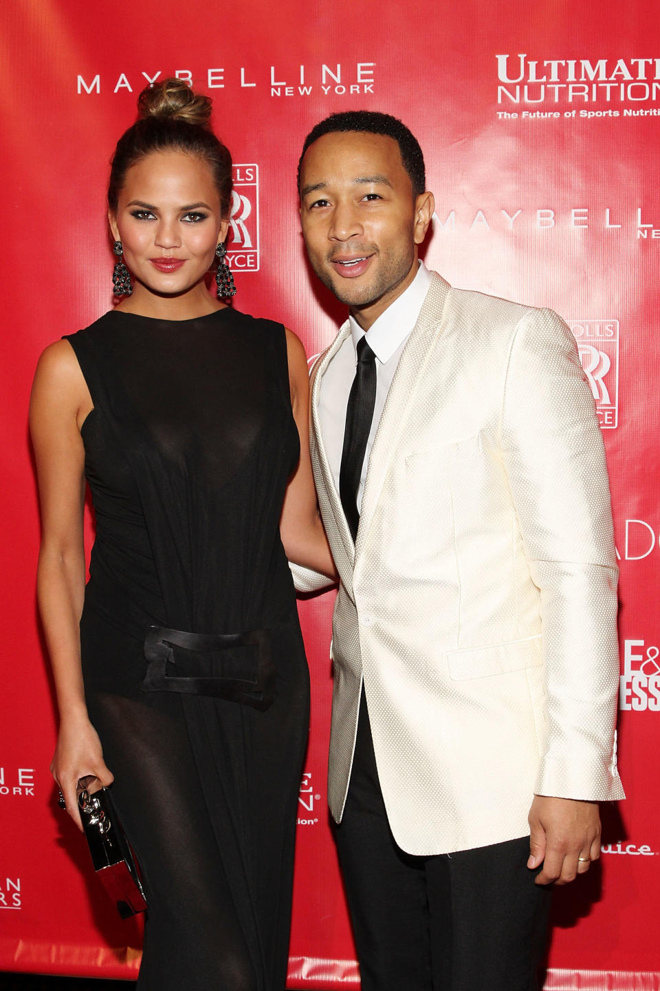 NEW YORK, NY - JANUARY 31:  Christine Teigen and John Legend attend Super Bowl XLVIII Party Hosted By Shape And Men's Fitness at Cipriani 42nd Street on January 31, 2014 in New York City.  (Photo by Mireya Acierto/Getty Images)