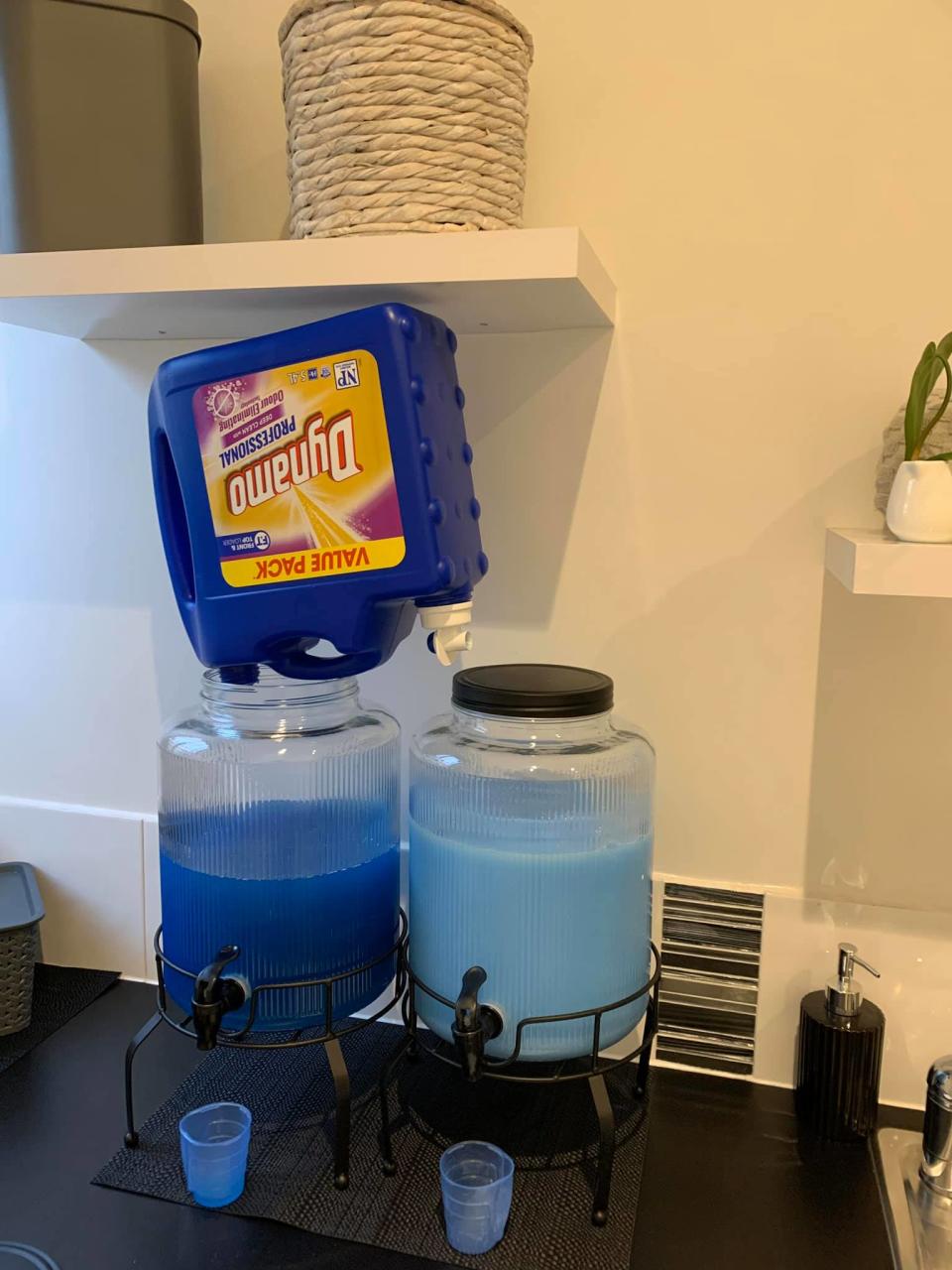 The mum-of-two shared her hack using Kmart drink dispensers to hold her detergent. Photo: Facebook