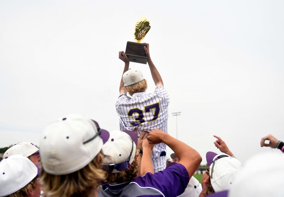 Abilene Wylie's Colby Garrett is lifted by the team after their win against Monterey in game two of the Region I-5A quarterfinal baseball series, Saturday, May 20, 2023, at Erine Johnson Field in Midland
