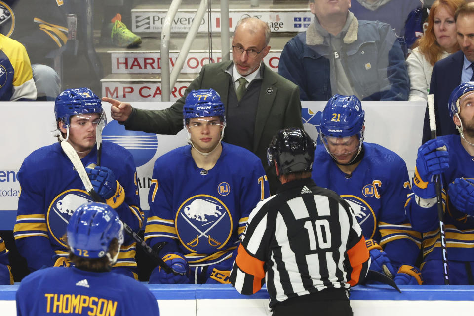 Buffalo Sabres head coach Don Granato talks with referee Kyle Rehman (10) during the third period of an NHL hockey game against the Carolina Hurricanes, Sunday, Feb. 25, 2024, in Buffalo, N.Y. (AP Photo/Jeffrey T. Barnes)