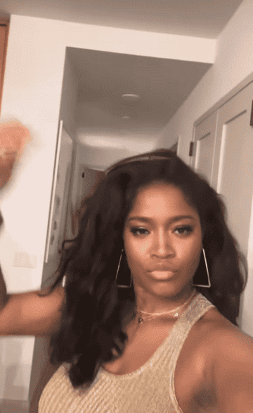 Keke Palmer running her hand through her hair