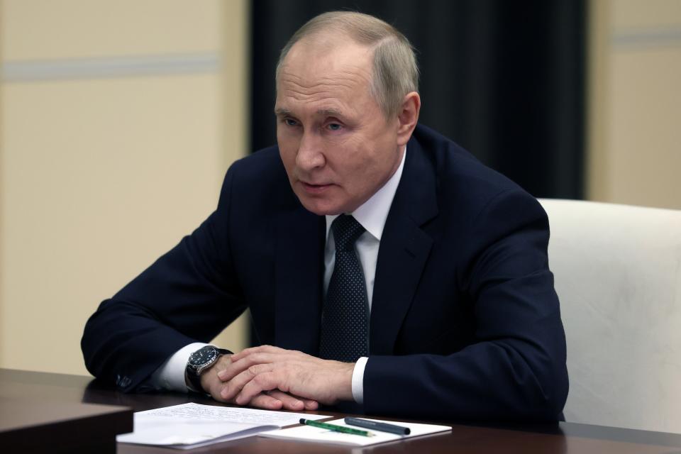 Russian President Vladimir Putin listens to Russian Defense Minister Sergei Shoigu during their meeting at the Novo-Ogaryovo residence outside Moscow, Russia, Friday, Oct. 28, 2022. (Mikhail Metzel, Sputnik, Kremlin Pool Photo via AP)