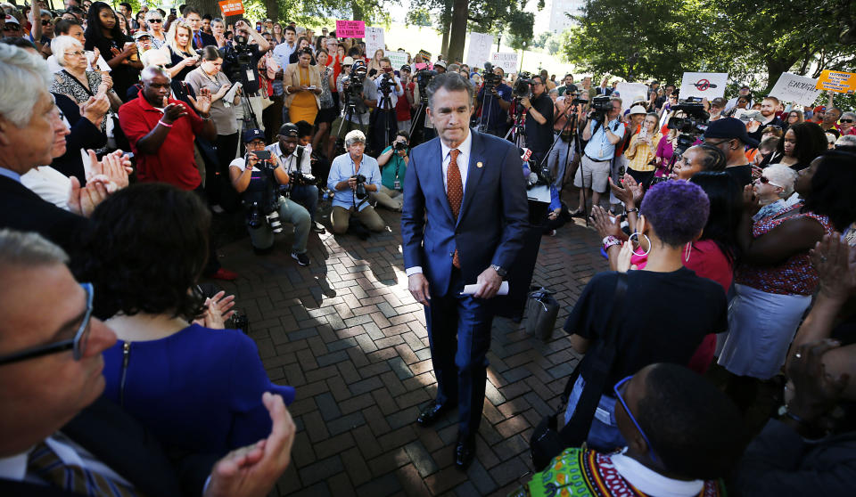 Gov. Ralph Northam walks away from the lectern after speaking at a rally against gun violence held on the Virginia State Capitol grounds, in Richmond, Va., Tuesday, July 9, 2019. Gov. Northam has called the legislature into special session to deal with the issues after 13 people were gunned down in a Virginia Beach mass shooting in May. (Joe Mahoney/Richmond Times-Dispatch via AP)