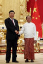 Myanmar's President Win Myint, right, shakes hands with Chinese President Xi Jinping during their meeting at the Presidential Palace in Naypyitaw, Myanmar, Friday, Jan. 17, 2020. (AP Photo/Aung Shine Oo)