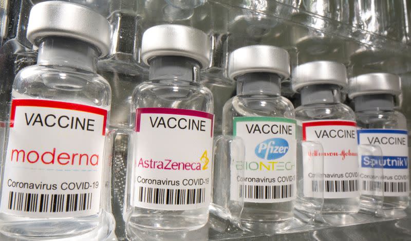 FILE PHOTO: Vials labelled "Moderna, AstraZeneca, Pfizer - Biontech, Johnson&Johnson, Sputnik V coronavirus disease (COVID-19) vaccine" are seen in this illustration picture