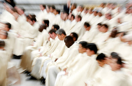 Priests attend the Easter vigil Mass led by Pope Francis in Saint Peter's Basilica at the Vatican, April 20, 2019. REUTERS/Remo Casilli