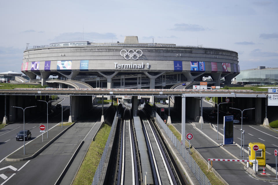 The Charles de Gaulle airport, terminal 1, where the olympic rings were installed, is seen in Roissy-en-France, north of Paris, Tuesday, April 23, 2024 in Paris. (AP Photo/Thibault Camus)