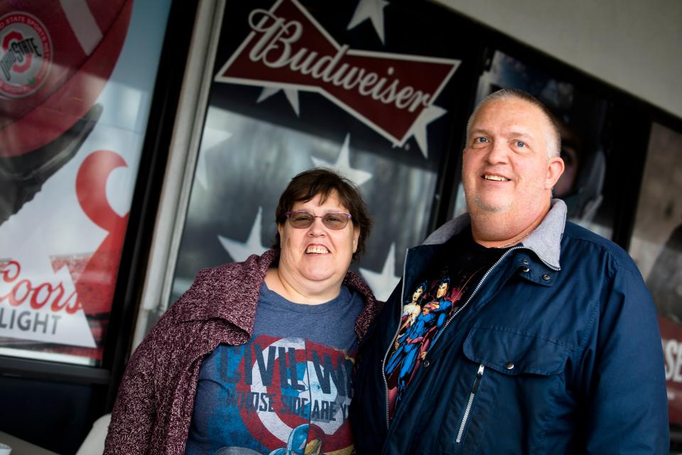 Mary Dallas and her husband, Kevin Dallas, both furloughed IRS employees stand outside This and That BBQ on Thursday, Jan. 17, 2019 in Florence, Ky.