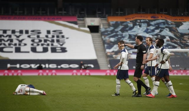 Son Heung-min, left, fell to the floor holding his face as United saw an opening goal disallowed