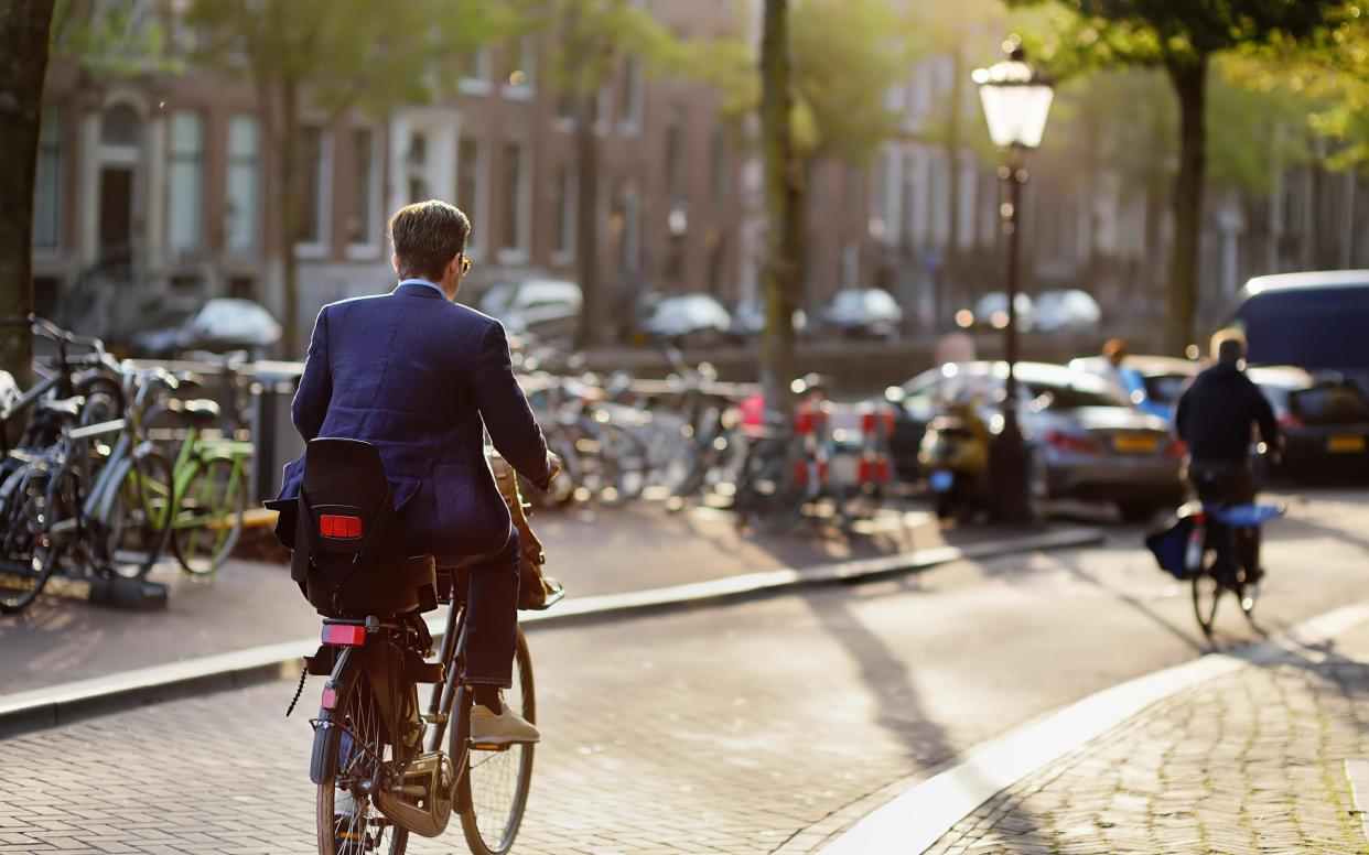 A cyclist in Amsterdam - Getty