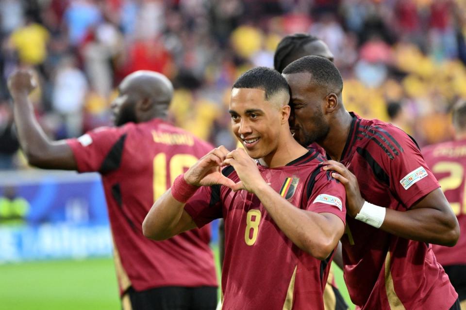 Youri Tielemans celebrates scoring Belgium’s opener against Romania (AFP)