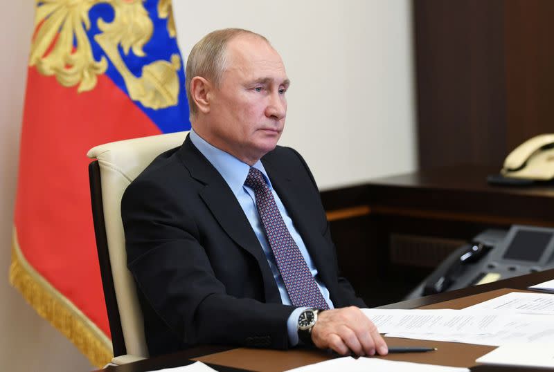 Russia's President Putin takes part in a video conference call outside Moscow