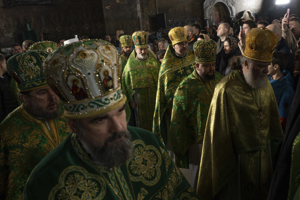 Priests of the Orthodox Church of Ukraine conduct the Palm Sunday service at Kiev-Pechersk Lavra monastery, Ukraine's most revered Orthodox site in Kyiv, Ukraine, Sunday, April 9, 2023. (AP Photo/Adam Pemble)