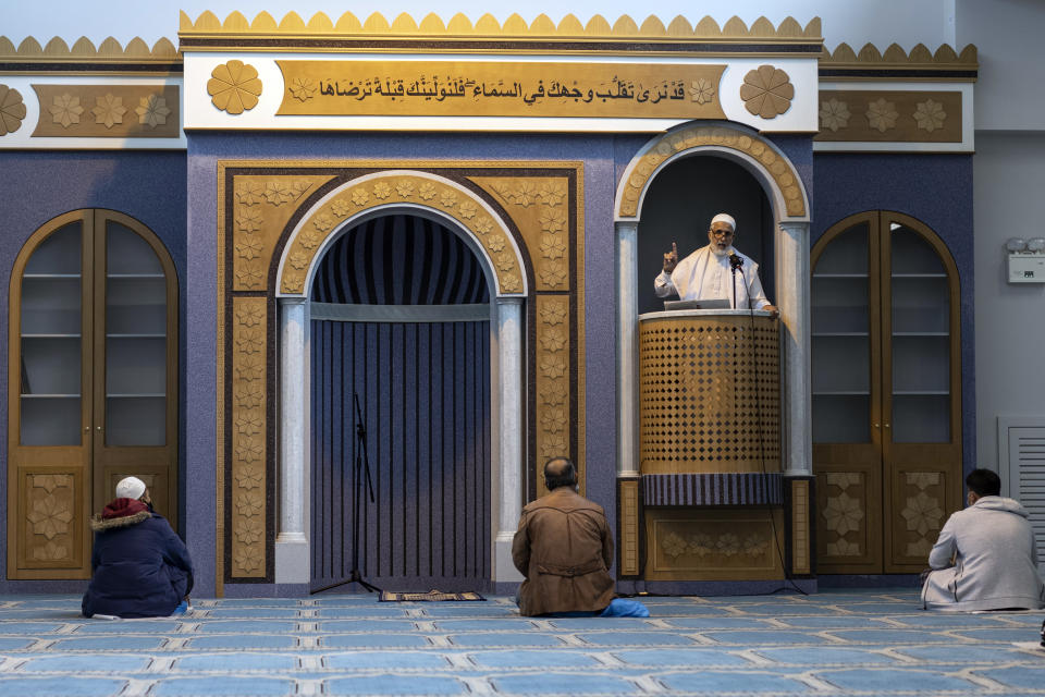 Muslims who live in Greece pray inside the first state-funded mosque in Athens on Friday, Nov. 6, 2020. Friday prayers have been held for the first time in the Greek capital's first state-sponsored mosque, which opened this week after years-long delays. The project to build a mosque in Athens has taken about 14 years and was dogged by protests, political controversy and delays in this heavily Christian Orthodox country. (AP Photo/Petros Giannakouris)